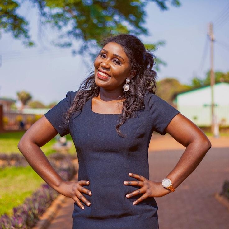 Avery Chen, Lead Design Curator at Novalytic Stream Hub, reviewing corporate floral arrangements